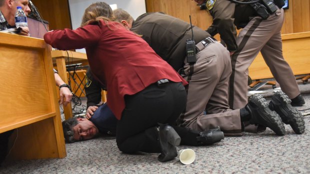 The father continued to ask for "one minute" alone with Nassar as he was restrained on the ground.