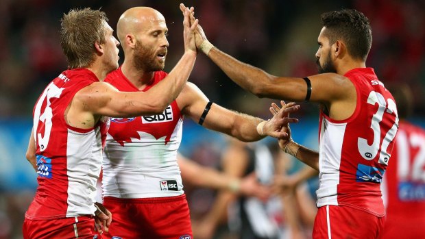 Getting the job done: Kieren Jack, Jarrad McVeigh and Lewis Jetta celebrate a Swans goal.