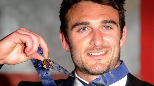 Goodbye Charlie: Jobe Watson with the 2012 Brownlow Medal he opted to return.