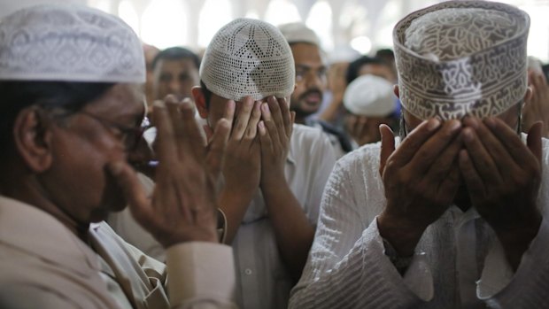 The father (left) and son (centre) of secular publisher Faisal Arefin Deepan at his funeral last year. 