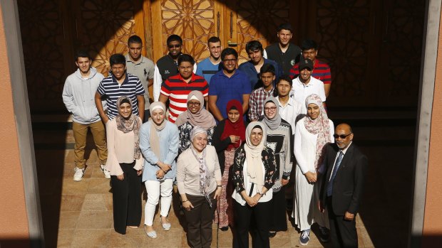 Malek Fahd School students pose for a picture with School Principal Aiyub Ahmed and teachers Tulin Bragg and Houda Kabbr.