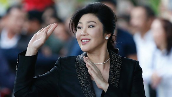 Former Thai prime minister Yingluck Shinawatra waves to supporters as she arrives at the Supreme Court for her final statements on August 1.