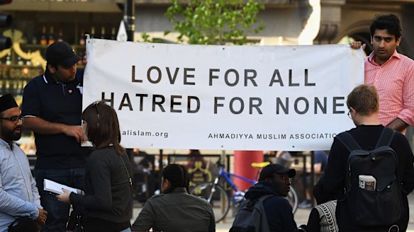 Members of the Muslim community attend a candlelit vigil, to honour the victims of Monday evening's terror attack, at Albert Square in Manchester.