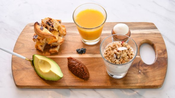 The breakfast board features a Jenga-like stack of Vegemite toast and coffee-bacon jam.