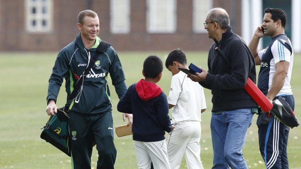 Fans greet Chris Rogers at a practice session at Watford, north-west of London.