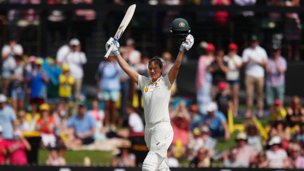 Cracking knock: Ellyse Perry salutes the crowd after reaching triple figures, a feat that couldn't be seen on television. 