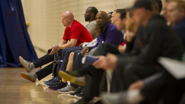 US College basketball coaches, including University of New Mexico's Chris Harriman (red shirt) came to the AIS to scout for Australian talent on Thursday.