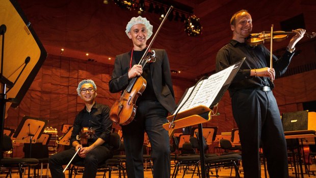 Members of the Corpus Medicorum orchestra  at the Melbourne Recital Centre. From left, Dr Gerry Ma, Phillip Antippa and Dr Bernd Merkel.