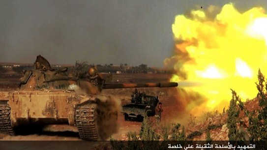 An image posted on the Twitter page of Syrian jihadists shows a rebel tank firing at Syrian troops at Khalsa village, southern Aleppo.