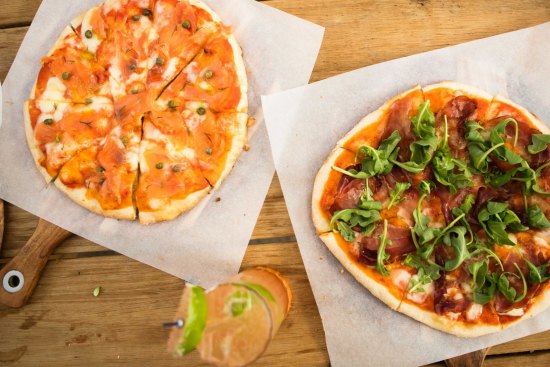 Smoked salmon and prosciutto and rocket pizzas at Flatiron Side Door wine bar, Kew.