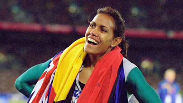 Cathy Freeman celebrates after winning the  Women's 400m Final at the Sydney Olympic Games in 2000. Her success epitomised Australia's self-belief.