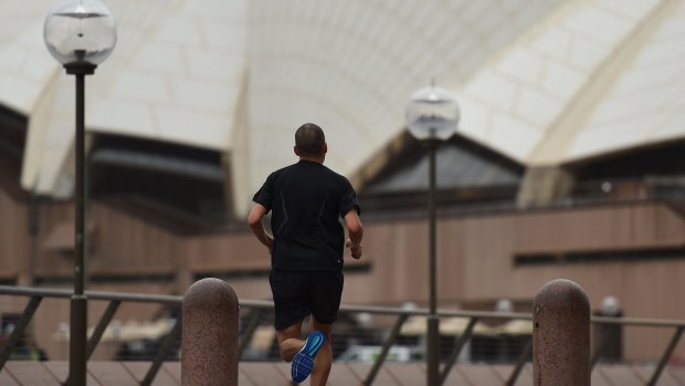 Rain thins out the crowds at popular Sydney sites.
