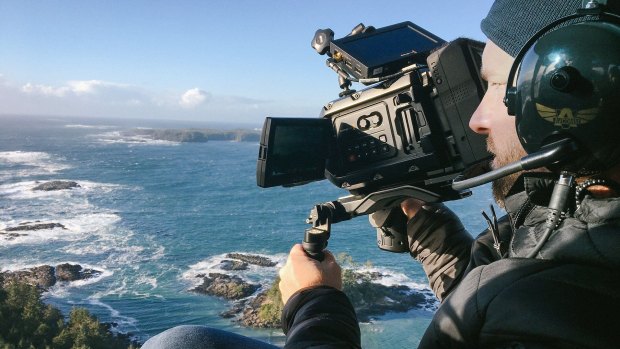 A Blackmagic camera in use during filming of a documentary.