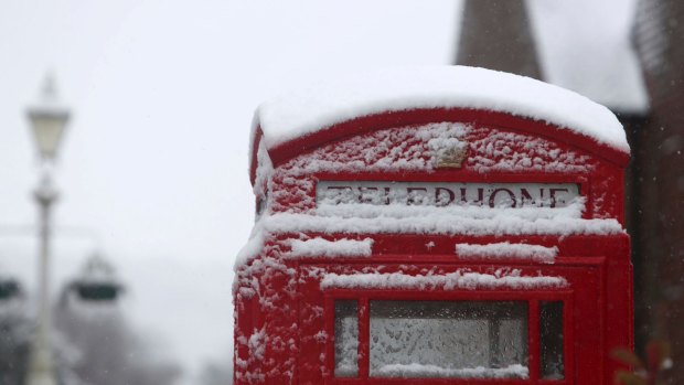 A snow covered phone box in Marlow, England, after heavy snow fell across parts of the UK.