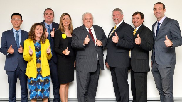 Clive Palmer poses for a group photo with his Party candidates including, Dio Wong, James MacDonald, Suellen Wrightson, Kevin Morgan, Catriona Thoolen and Kristian Rees during the Palmer United campaign in Brisbane.
