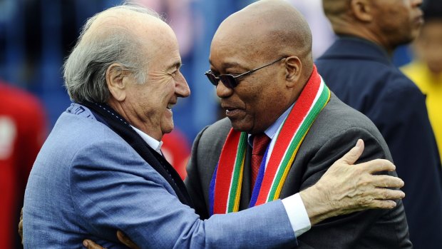 Outgoing FIFA president Sepp Blatter embraces  South Africa's President Jacob Zuma at a football event in Alexandra Township, near Johannesburg, in 2010.