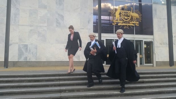 Prosecutors leave the ACT Supreme Court after the Vojneski verdict was handed down.