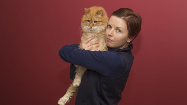Thirsty cat: Canberra Cat Vet head nurse Leanne Kentwell with Oliver.