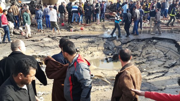 The crater left by a suicide car bomb outside a police station in Egypt on Sunday. 