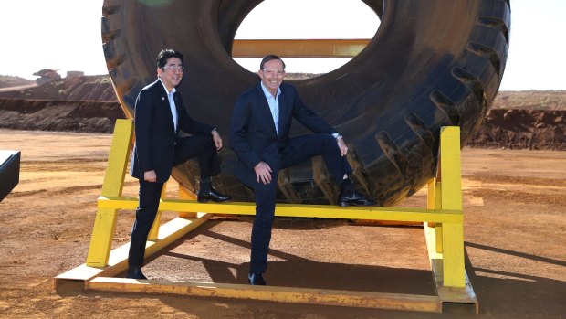 Japanese Prime Minister Shinzo Abe and Prime Minister Tony Abbott during a visit to an iron ore mine in the Plibera. 