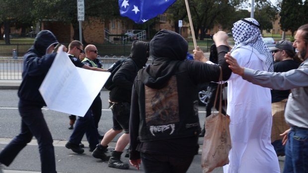 Protesters - including one dressed as a sheik - clash outside the Halal festival in Ascot Vale. 
