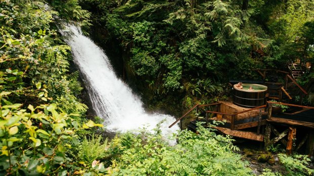 A hot tub built beside the waterfall at Nimmo Bay Wilderness Resort, an eco resort located in the southern Great Bear Rainforest of British Columbia, Canada. 