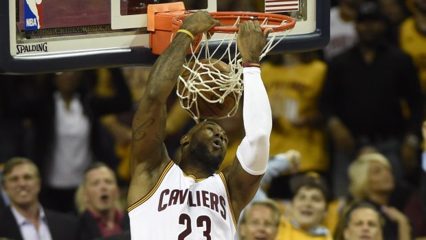 Reverse jam: Cleveland Cavaliers forward LeBron James dunks against the Toronto Raptors.