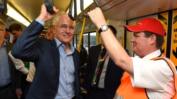 Prime Minister Malcolm Turnbull rides the new Redcliffe railway line in Brisbane,