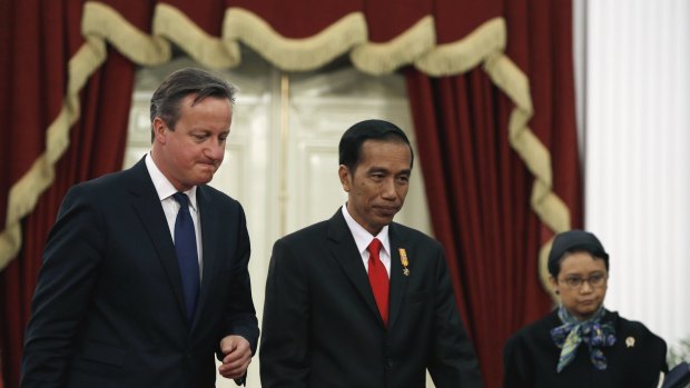 Britain's Prime Minister David Cameron  (left)  with Indonesian President Joko Widodo in Jakarta on Monday. The two discussed tackling Islamist militancy.