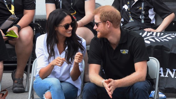 Prince Harry and his girlfriend Meghan Markle attend a wheelchair tennis event at the Invictus Games in Toronto, Monday, Sept. 25, 2017.
