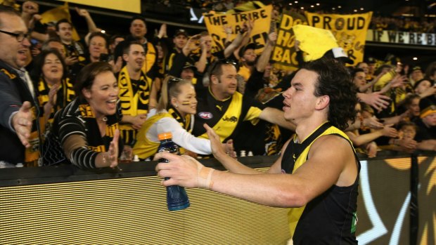 Going to the big dance: Daniel Rioli celebrates with Tiger fans after the preliminary final win.