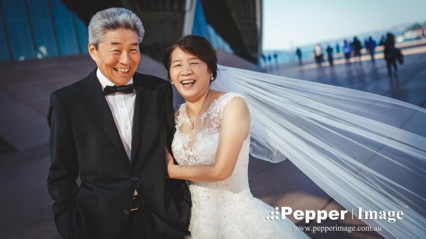 They didn't wear a tux or bridal gown when they married in 1974, so to celebrate their 42nd wedding anniversary Mr Zhao and Mrs Lv did just that.