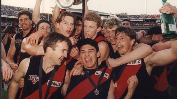 James Hird (second row, third from left) with the victorious Bombers after the 1993 grand final.