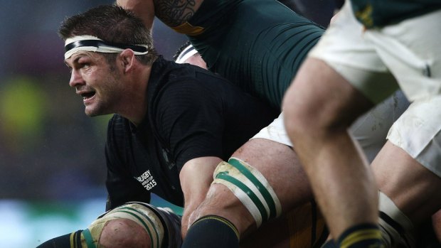 Under a shadow: New Zealand's captain Richie McCaw is caught in a ruck during the semi-final.