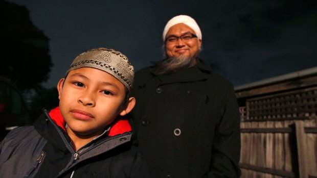 Abdullah Utmo and his son, Ahmad, seven.