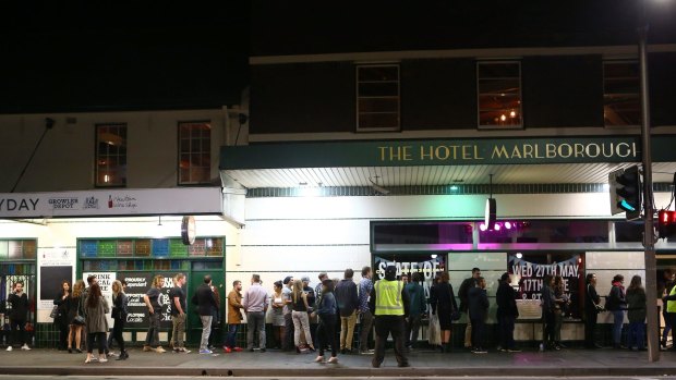 People line up to get into a pub in Newtown on June 13.