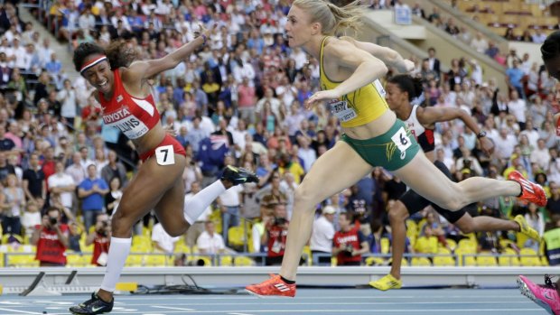 Brianna Rollins, left, wins gold to Sally Pearson silver at the World Athletics Championships in the Luzhniki stadium in Moscow. Photo: AP