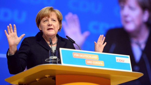 German Chancellor and Chairwoman of the German Christian Democrats (CDU) Angela Merkel speaks to CDU party delegates at the annual CDU federal congress on Monday. 