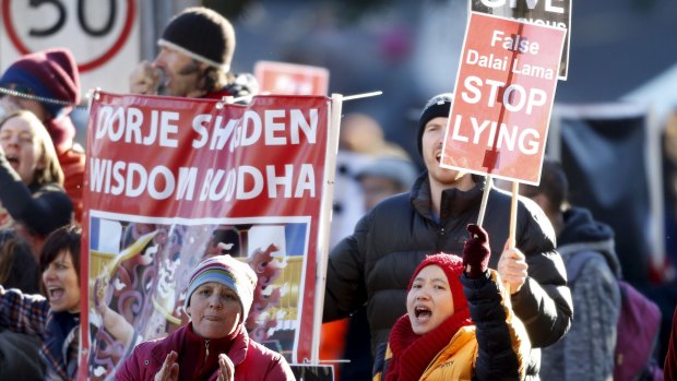 Demonstrators protesting against a visit by exiled Tibetan spiritual leader the Dalai Lama.