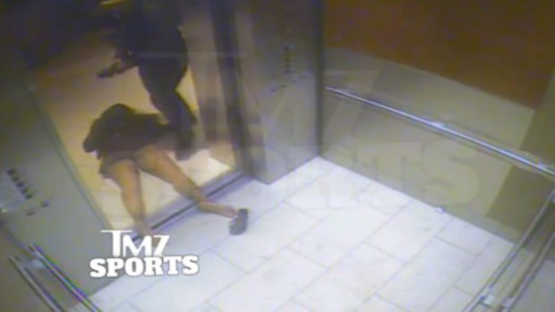 A still of Janay Palmer lying unconscious after being struck in a casino elevator by  Ray Rice.