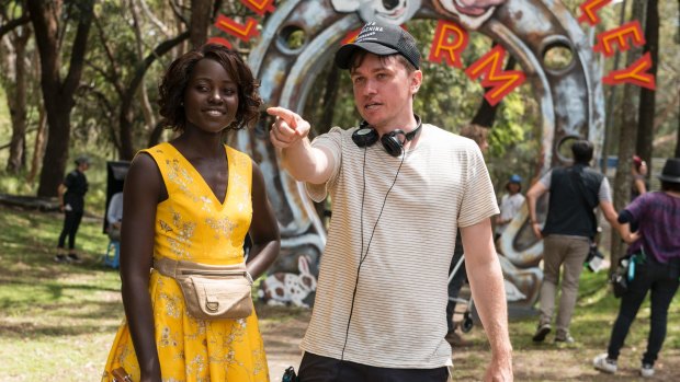 Lupita Nyong'o and director Abe Forsythe on the set of the film Little Monsters in Sydney.