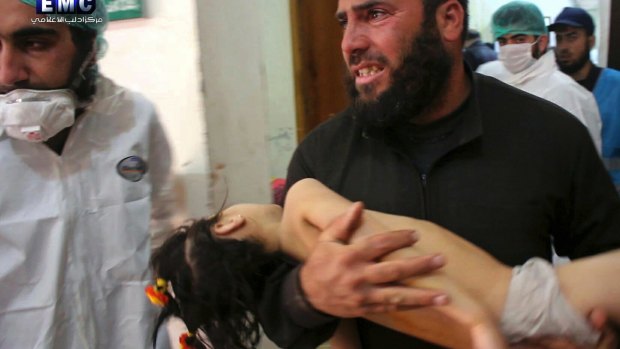 This picture, provided by the rebel-controlled Idlib Media Centre,  shows a man carrying a child into hospital following a chemical attack in Khan Sheikhoun, Syria, in April.