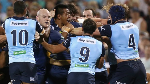 Easy boys: The Brumbies and Waratahs get up close and personal in Canberra.