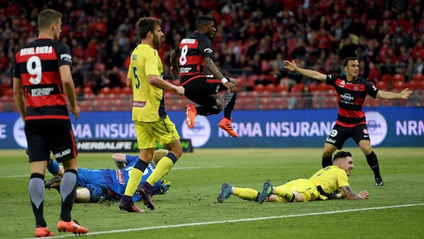 On the spot: Roly Bonevacia of the Wanderers scores after the Mariners goalkeeper Tom Glover spilled the ball.