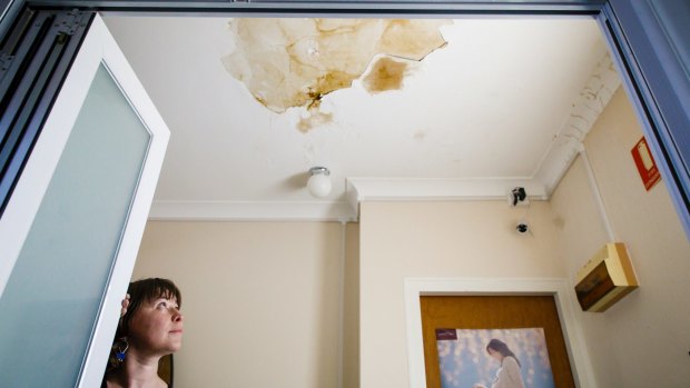 Emma Hely is frustrated by a leaky roof at her business in Ainslie. 