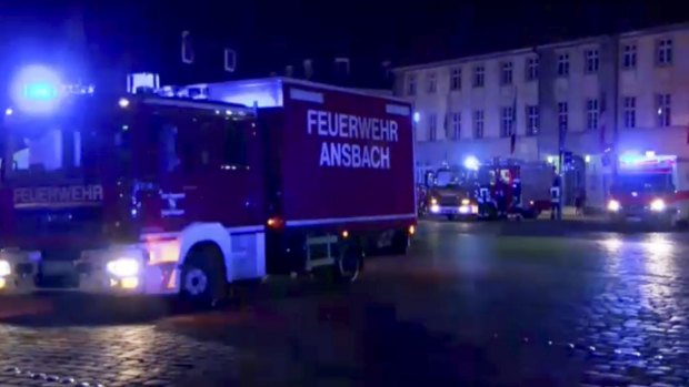 Fire trucks and ambulances stand in the city center of Ansbach.