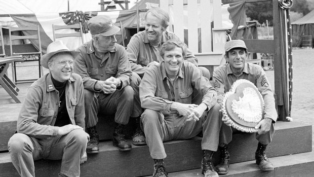 William Christopher (left) with cast members of M*A*S*H in 1982. 