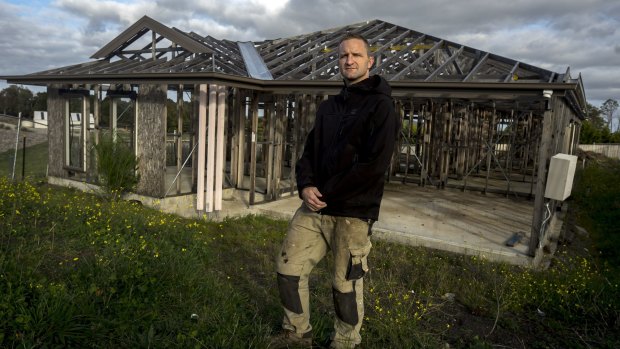 Mr Draper in front of the unfinished Simonds house on the Wallan site last year. 