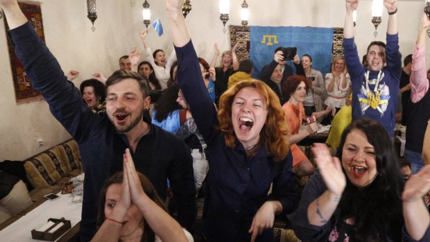 Ukrainians cheer as Jamala wins the 2016 final of the Eurovision Song Contest.