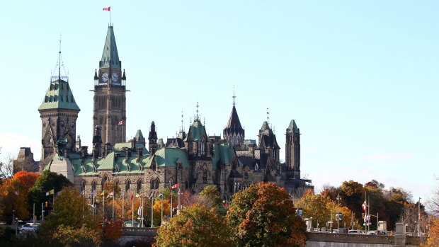 Scene of an attack: The Canadian flag flies over Parliament Hill in Ottawa.